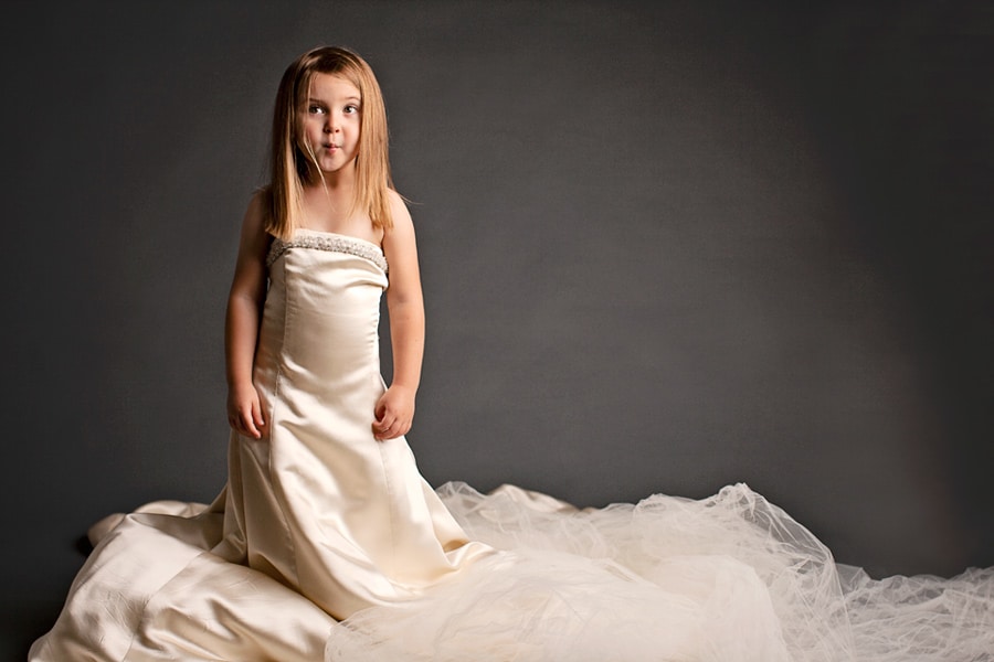 mom and daughter wearing generations of wedding dresses in sentimental photoshoot