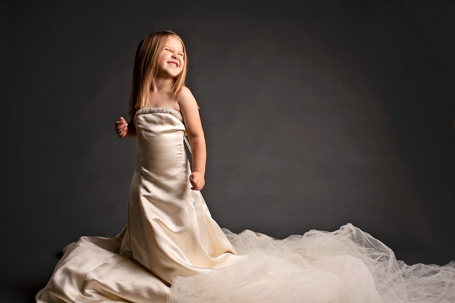 mom and daughter wearing generations of wedding dresses in sentimental photoshoot