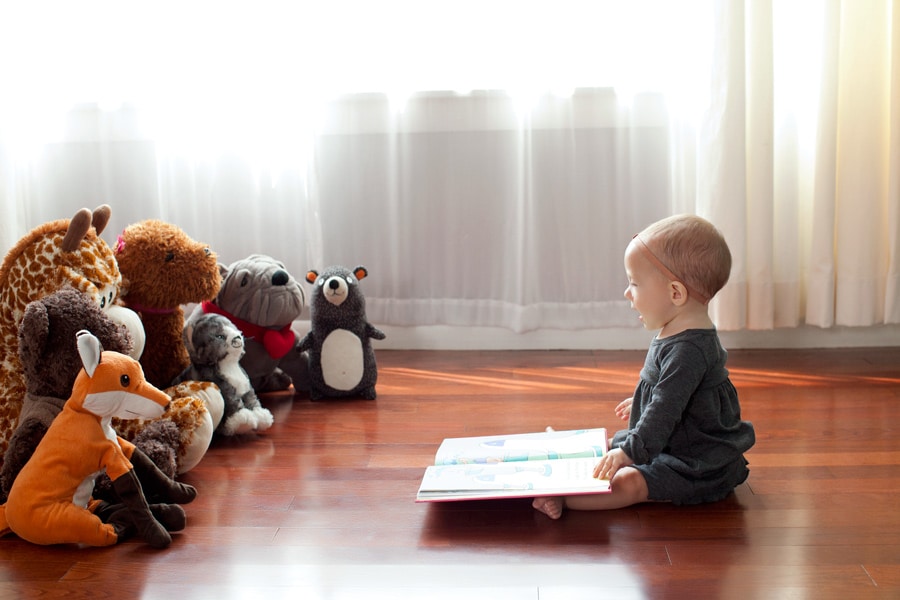 beautiful little girl posing with peony in private studio
