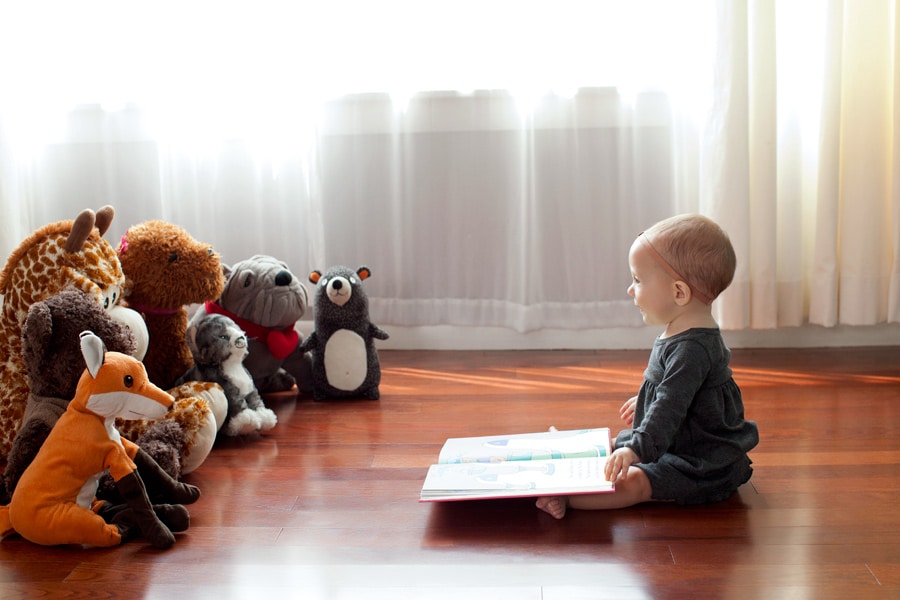 beautiful little girl posing with peony in private studio