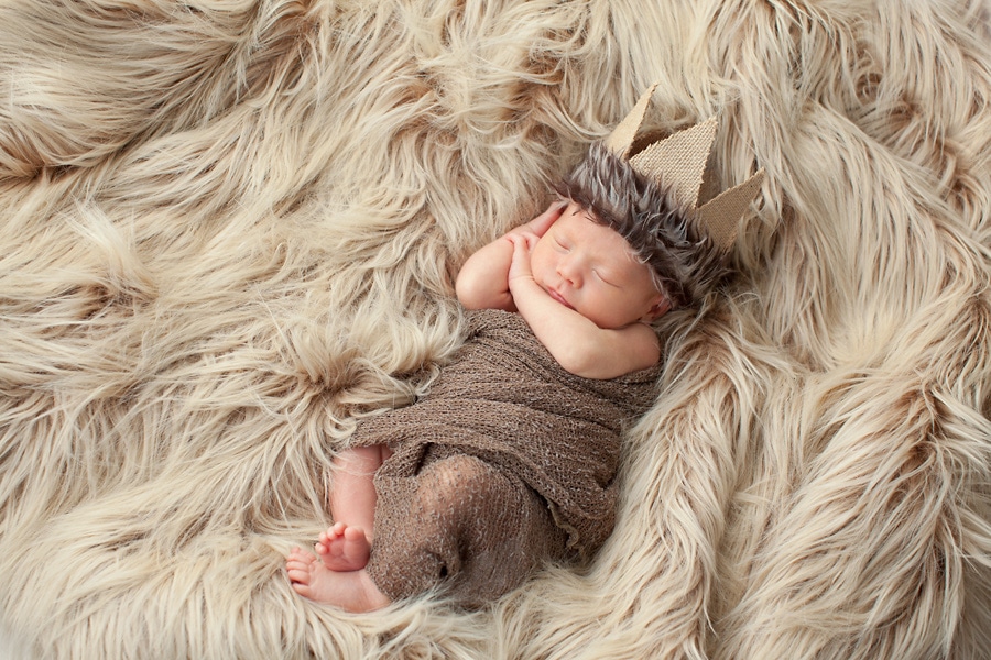 beautiful newborn baby boy snuggled up for photoshoot in private Dallas Studio session