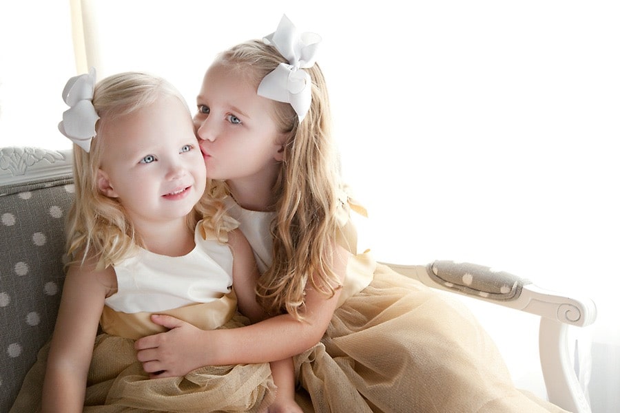 adorable sister siblings photos wearing matching outfits in private Dallas Studio