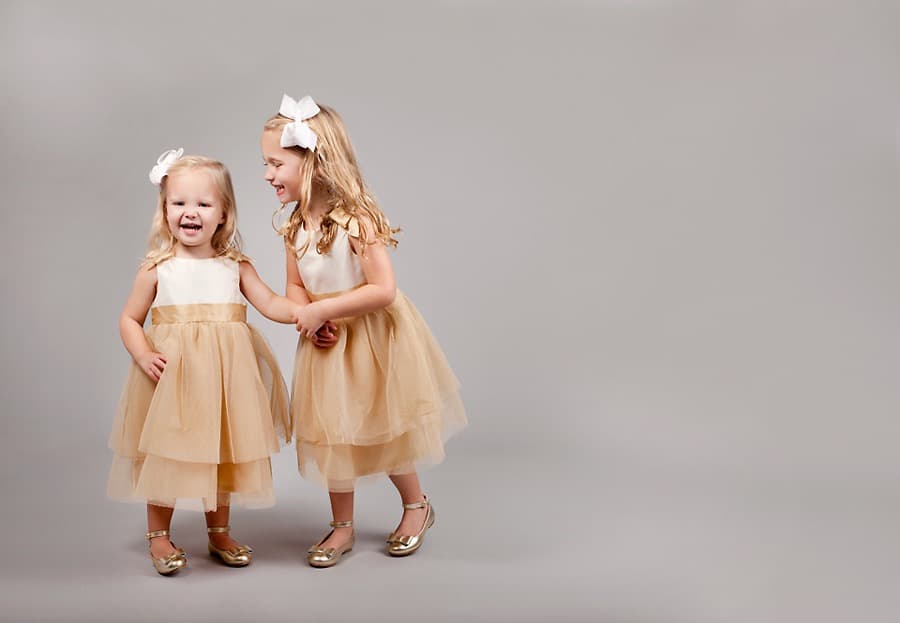adorable sister siblings photos wearing matching outfits in private Dallas Studio