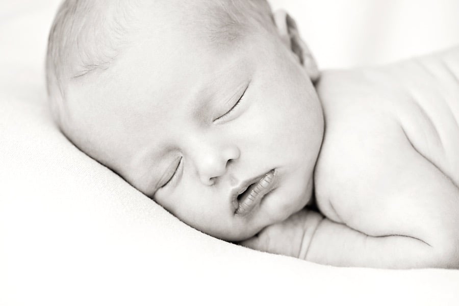 gorgeous newborn baby brother in private dallas studio with siblings