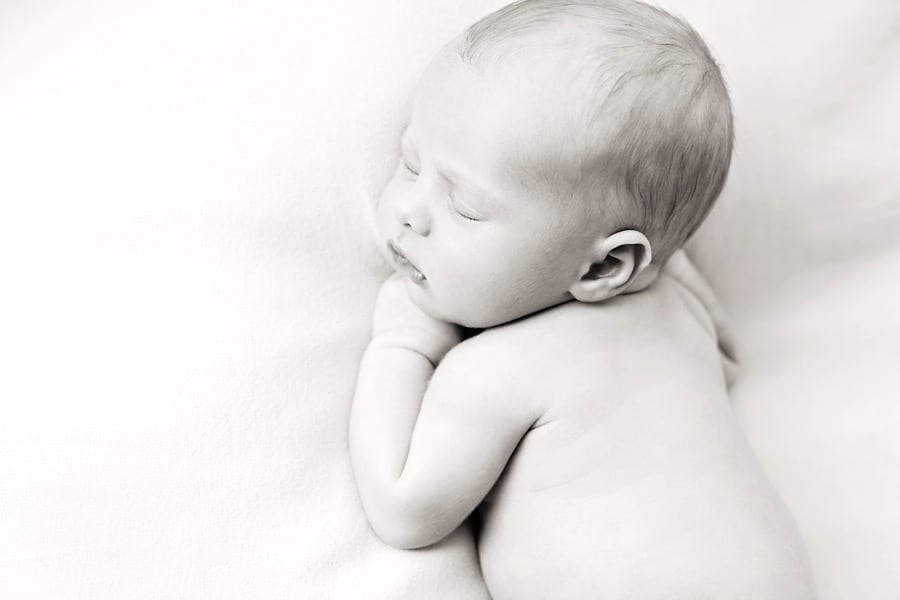 gorgeous newborn baby brother in private dallas studio with siblings