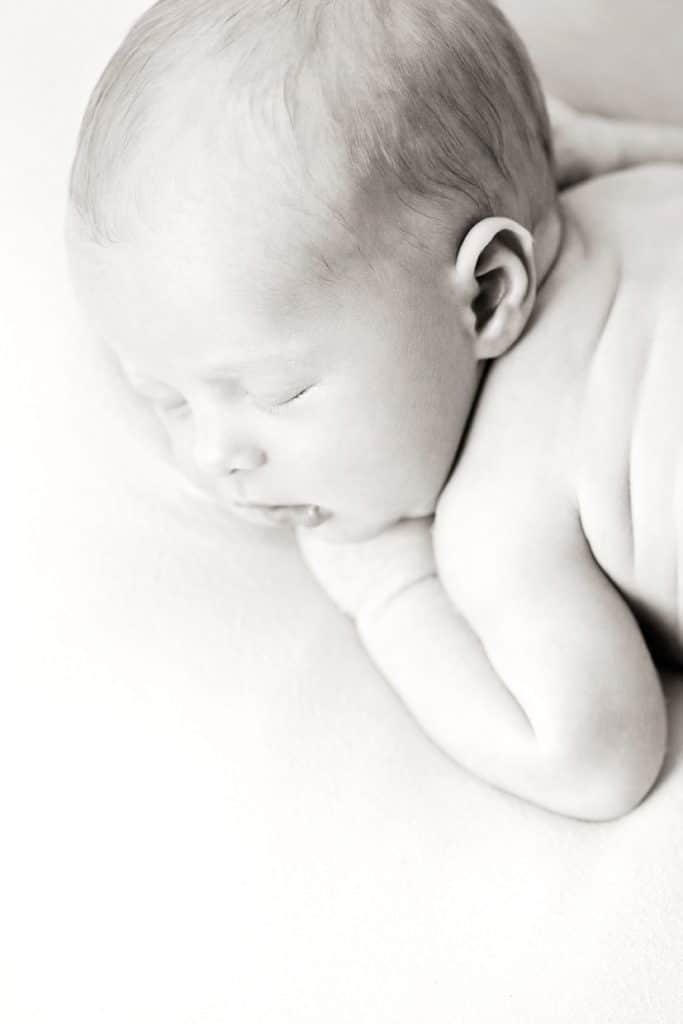 gorgeous newborn baby brother in private dallas studio with siblings