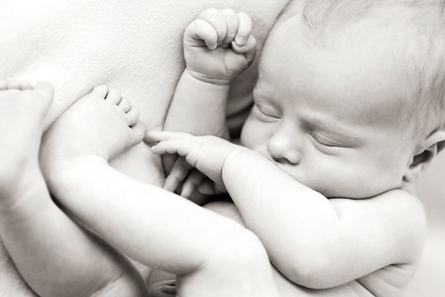 gorgeous newborn baby brother in private dallas studio with siblings