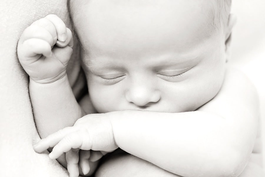 gorgeous newborn baby brother in private dallas studio with siblings