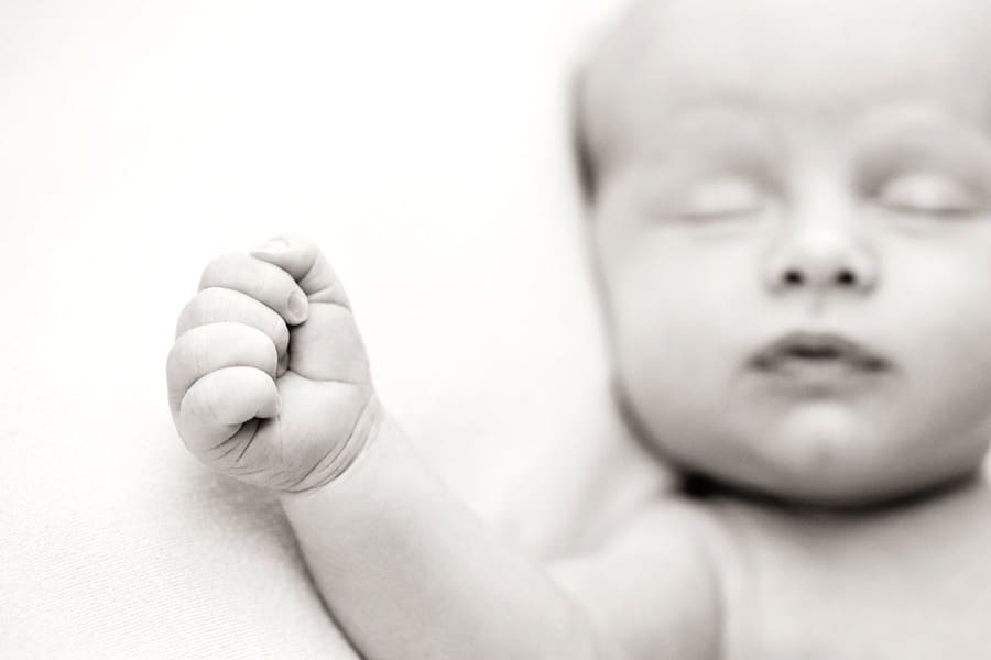 gorgeous newborn baby brother in private dallas studio with siblings