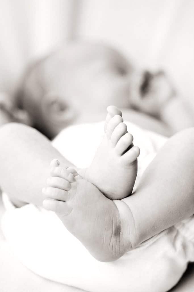 gorgeous newborn baby brother in private dallas studio with siblings