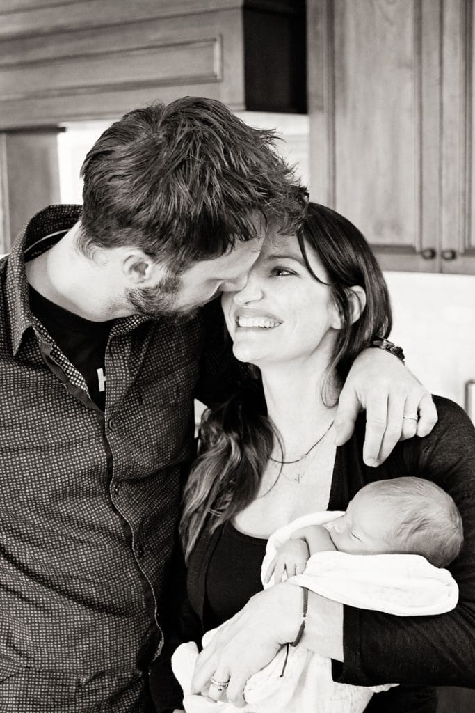 in-home newborn session with the cutest baby posing