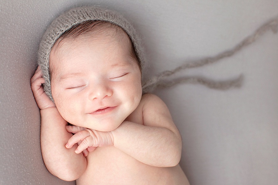 The most perfect face and dimples on a newborn baby girl -