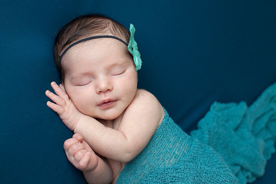 newborn baby girl in luxury Dallas Studio