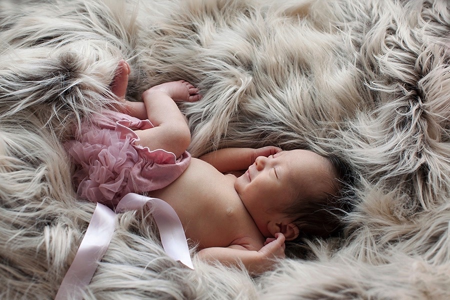 the cutest baby girl snoozing in private Dallas Studio