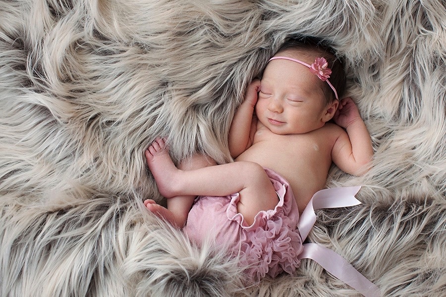 the cutest baby girl snoozing in private Dallas Studio