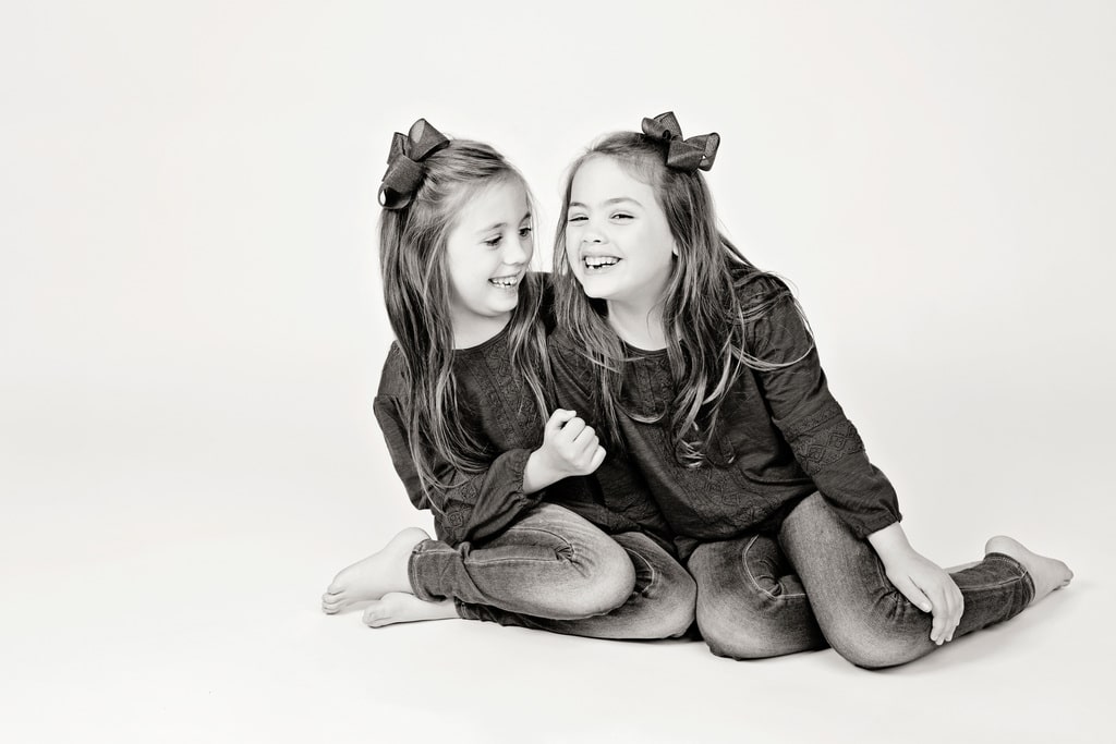 adorable sister posing in private Dallas Studio