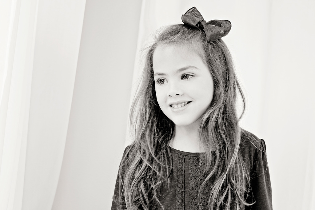 adorable sisters posing in private Dallas Studio