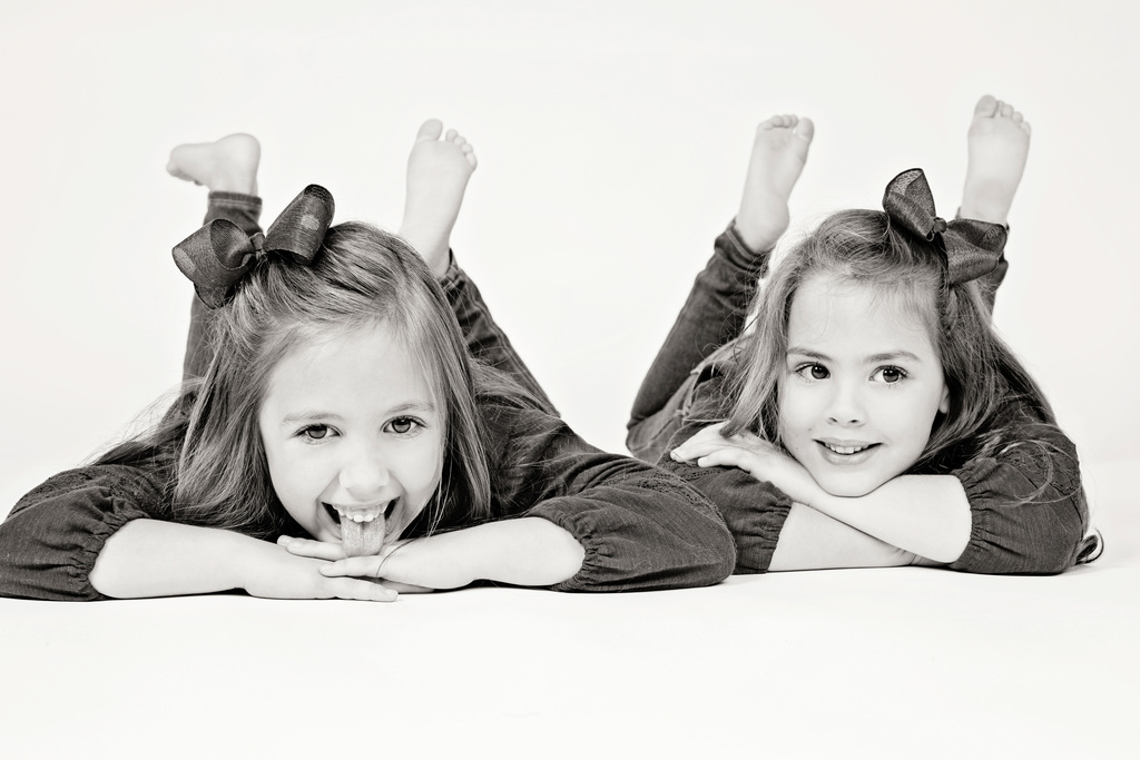 adorable sisters posing in private Dallas Studio