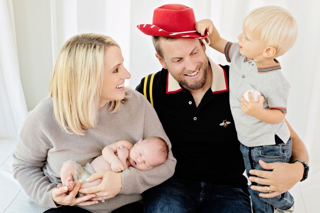 Gorgeous family posing with two kids in studio session