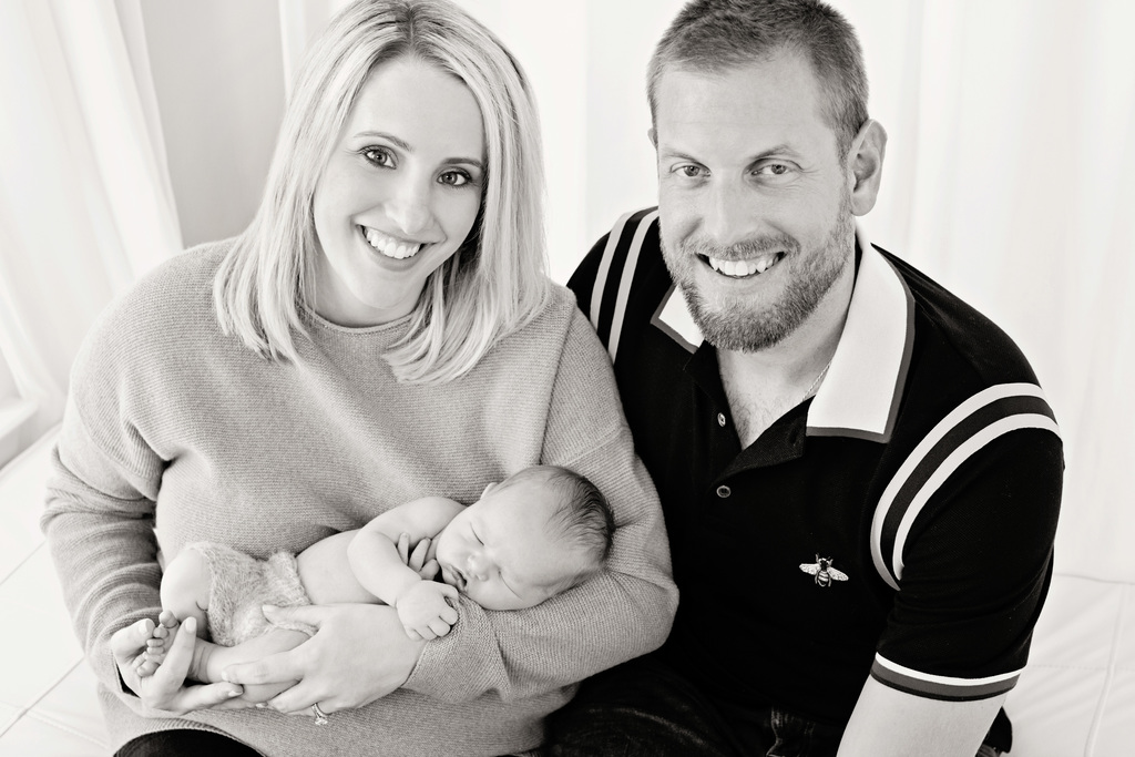 Gorgeous family posing with kids in studio session