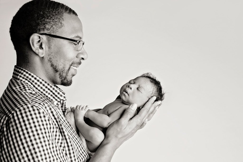 dad adores new baby in studio session