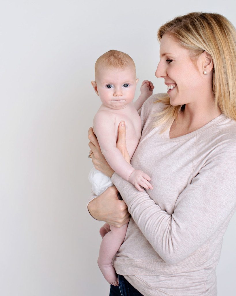 mom showing off new baby in private studio session