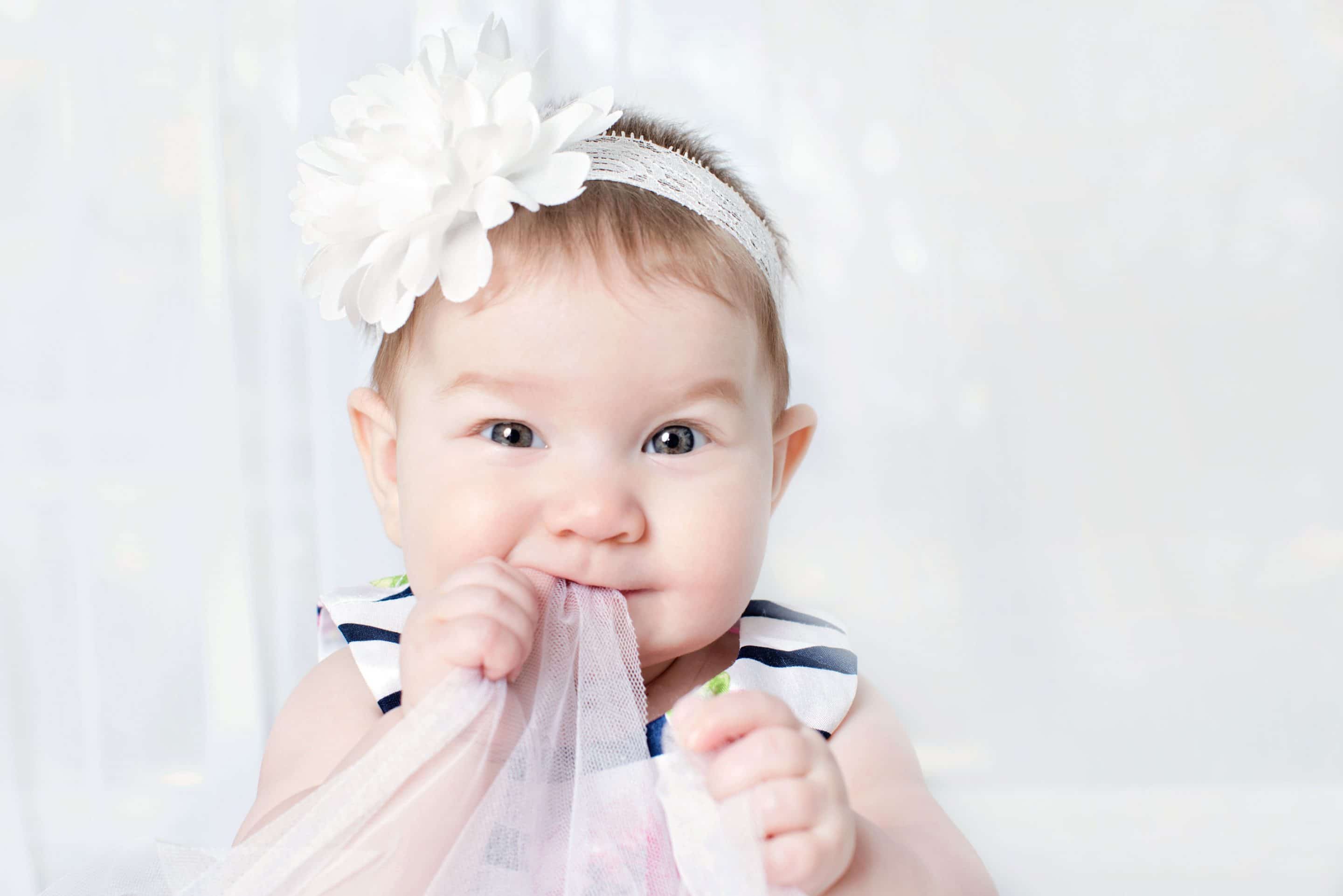 beautiful six-month little girl posing in private studio session