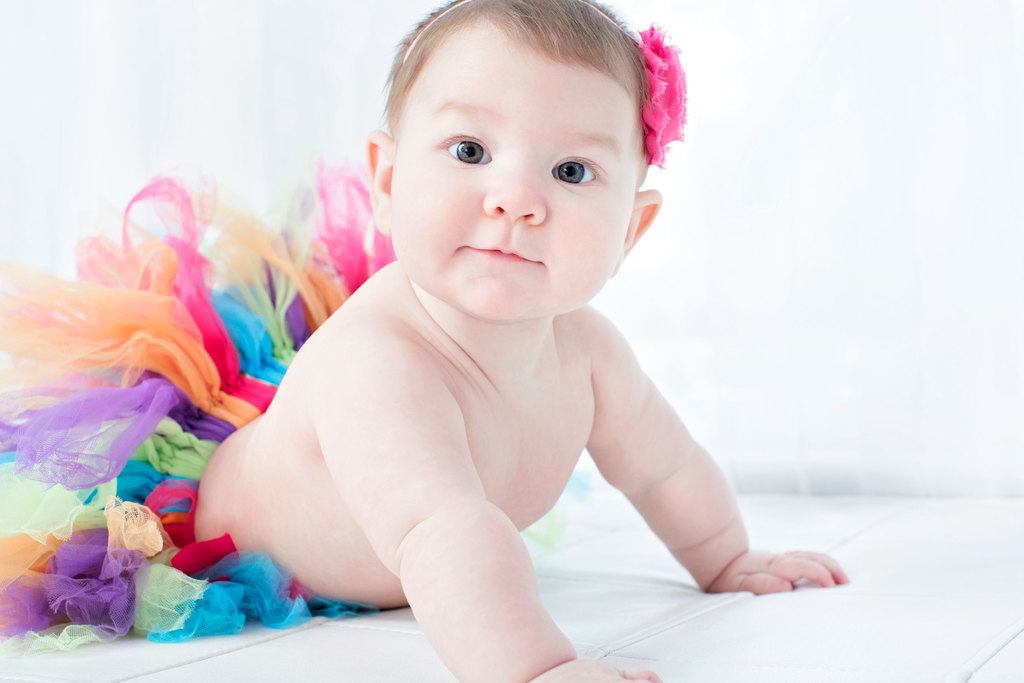 beautiful six-month little girl posing in private studio session