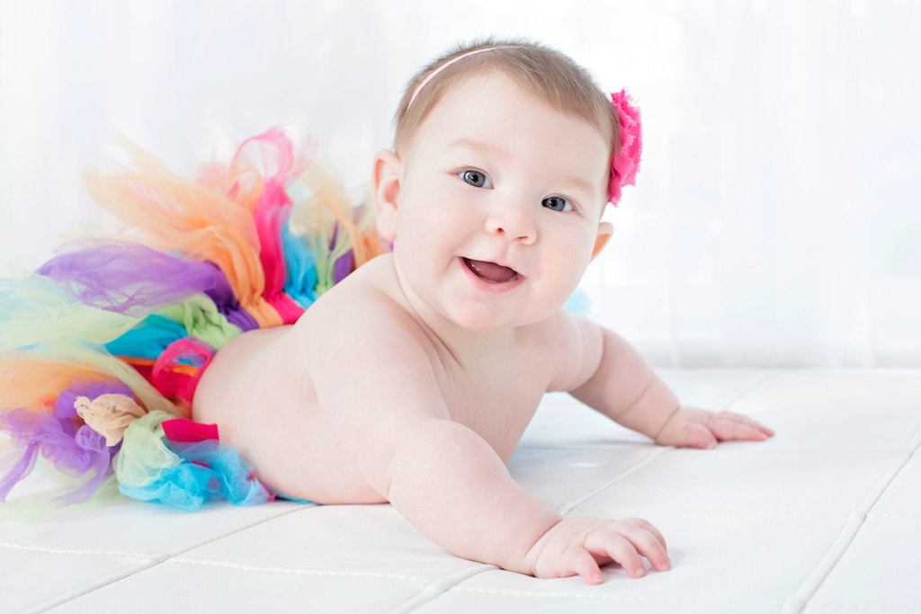 beautiful six-month little girl posing in private studio session