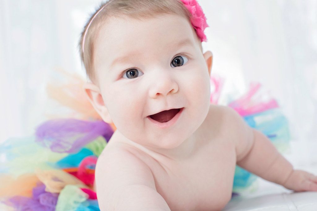 beautiful six-month little girl posing in private studio session