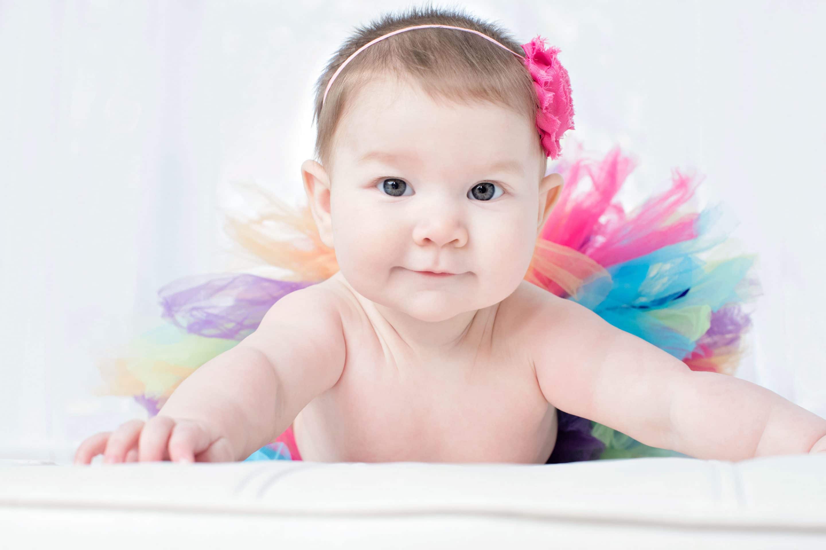 beautiful six-month little girl posing in private studio session