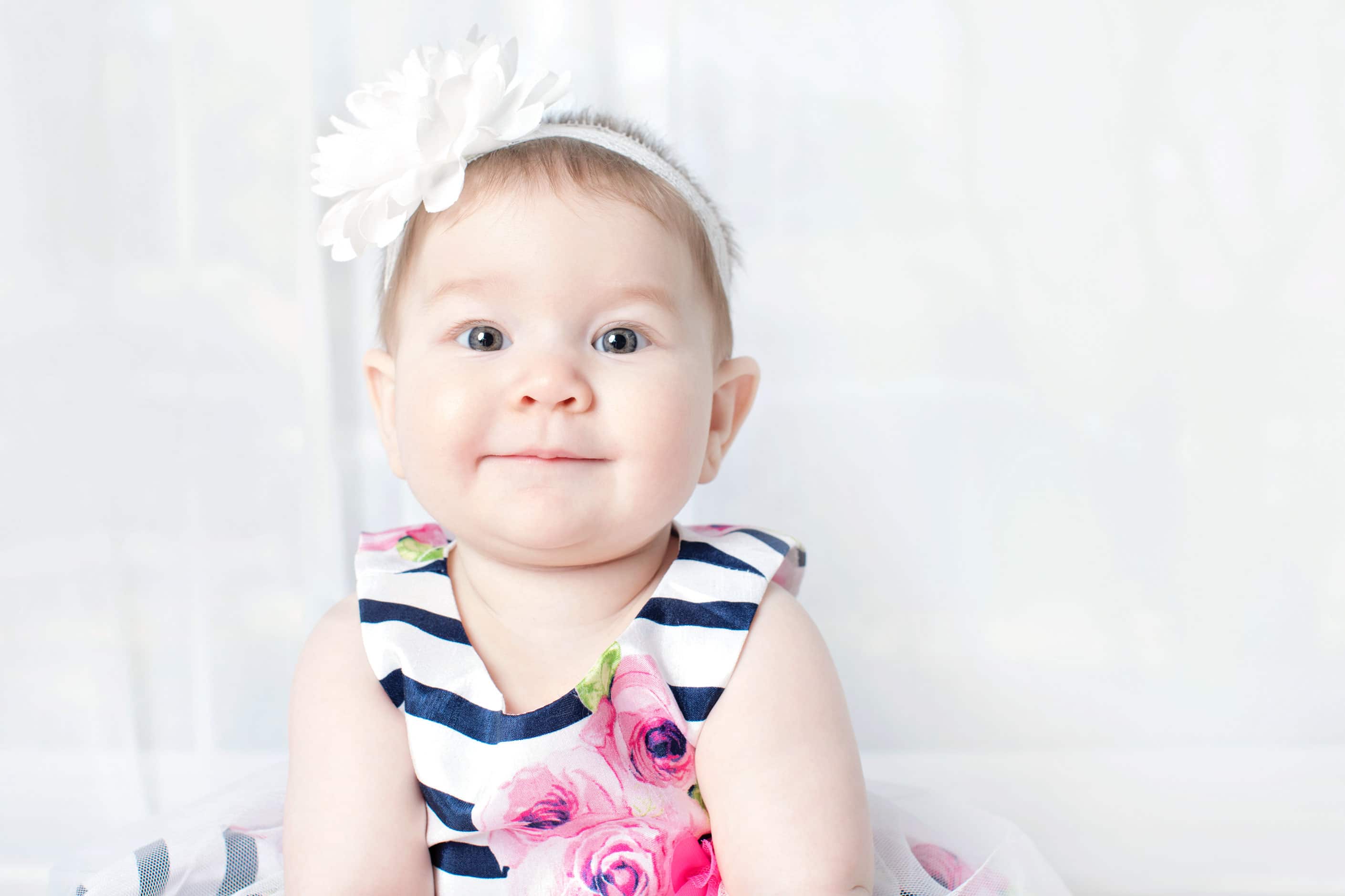 beautiful six-month little girl posing in private studio session