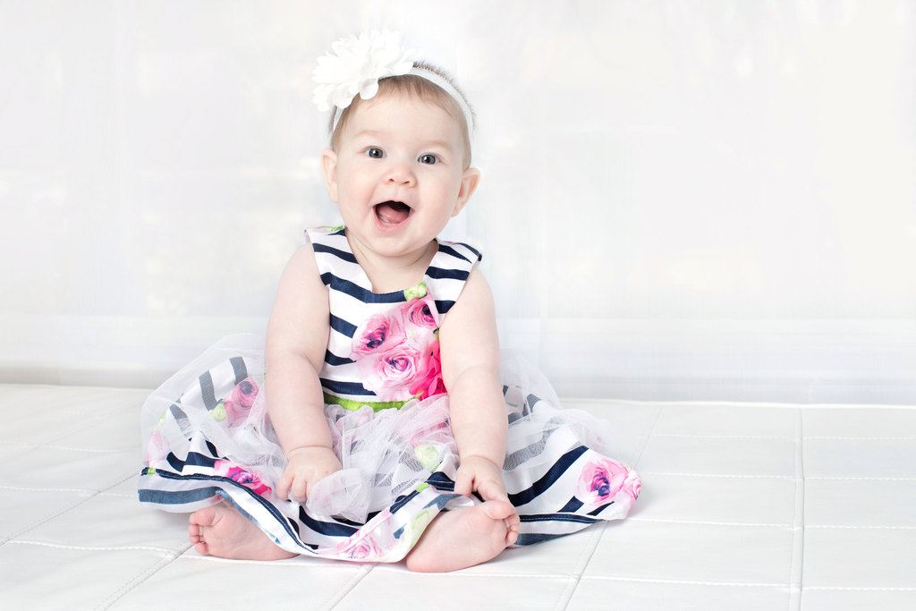 beautiful six-month little girl posing in private studio session