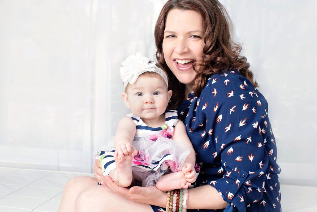 beautiful six-month little girl posing in private studio session