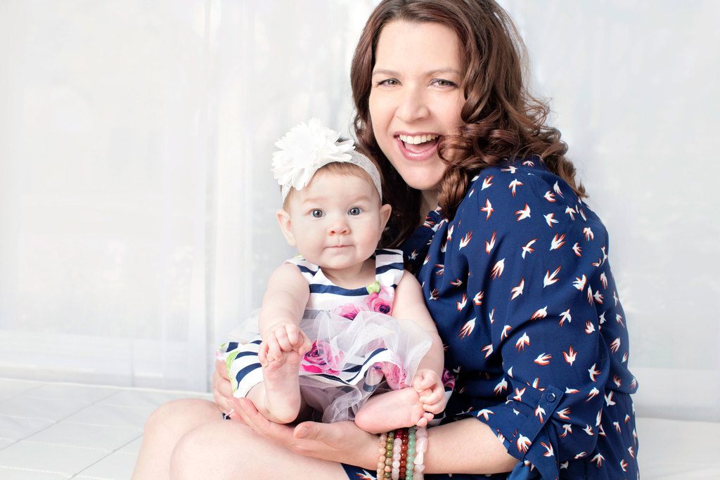 beautiful six-month little girl posing in private studio session