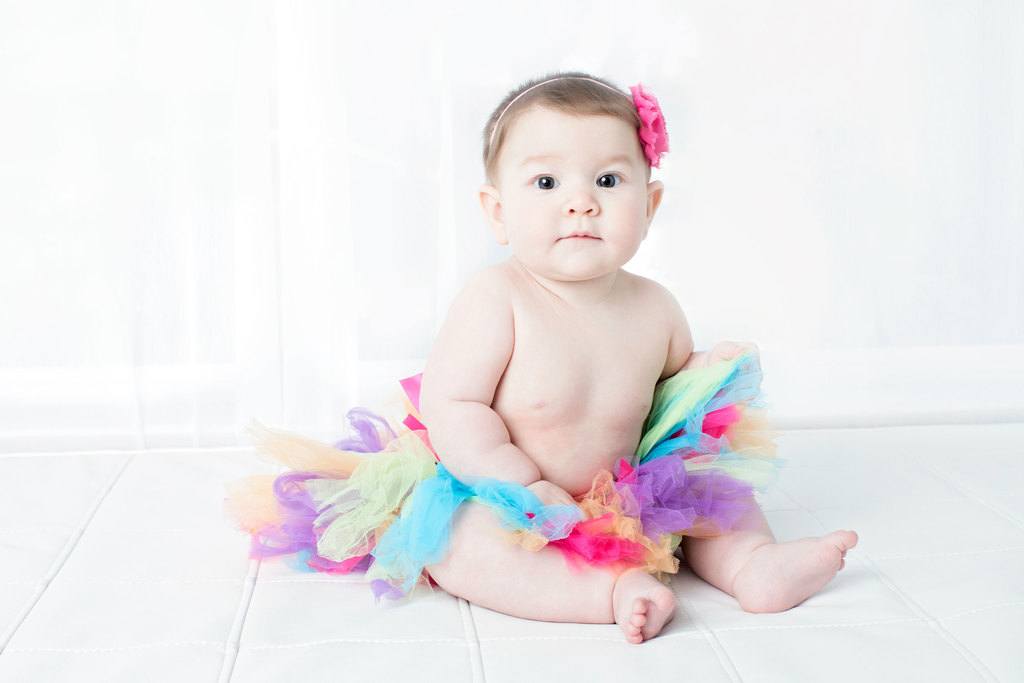 beautiful six-month little girl posing in private studio session