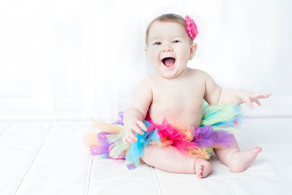 beautiful six-month little girl posing in private studio session