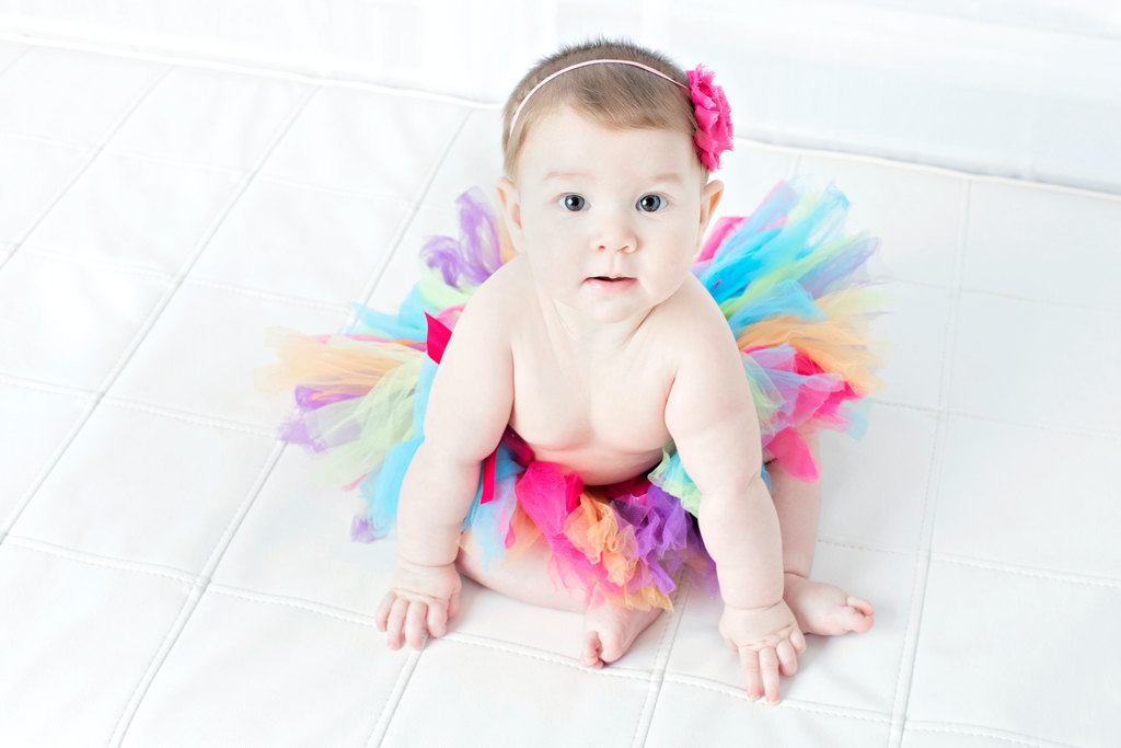 beautiful six-month little girl posing in private studio session