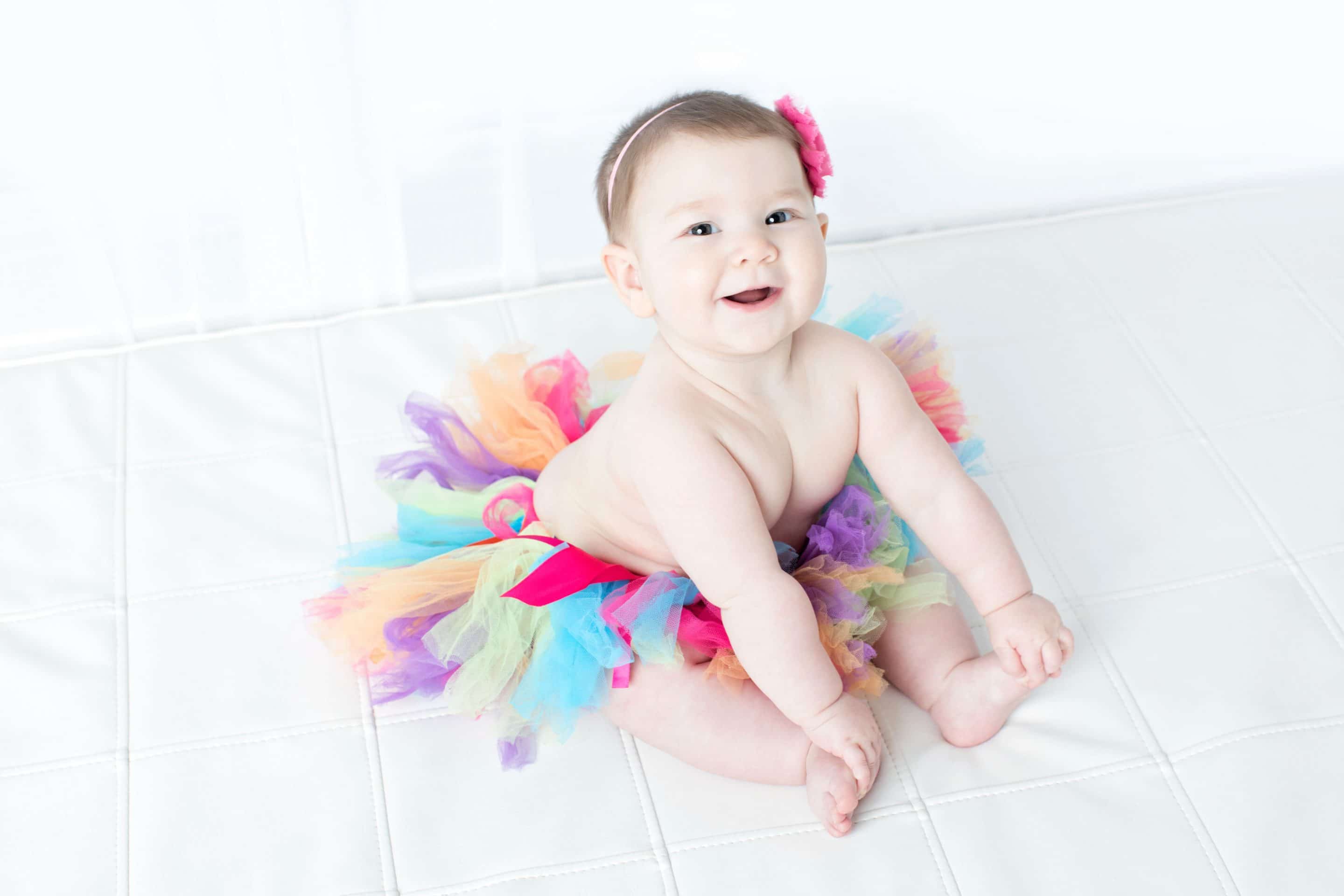 beautiful six-month little girl posing in private studio session