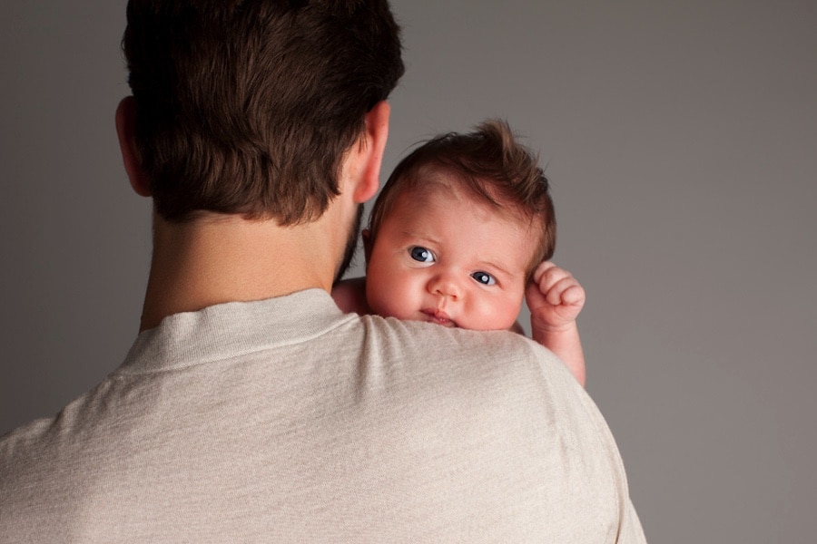 newborn baby boy with dad in private studio
