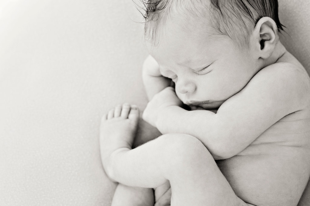 gorgeous sleepy newborn snoozing in studio 