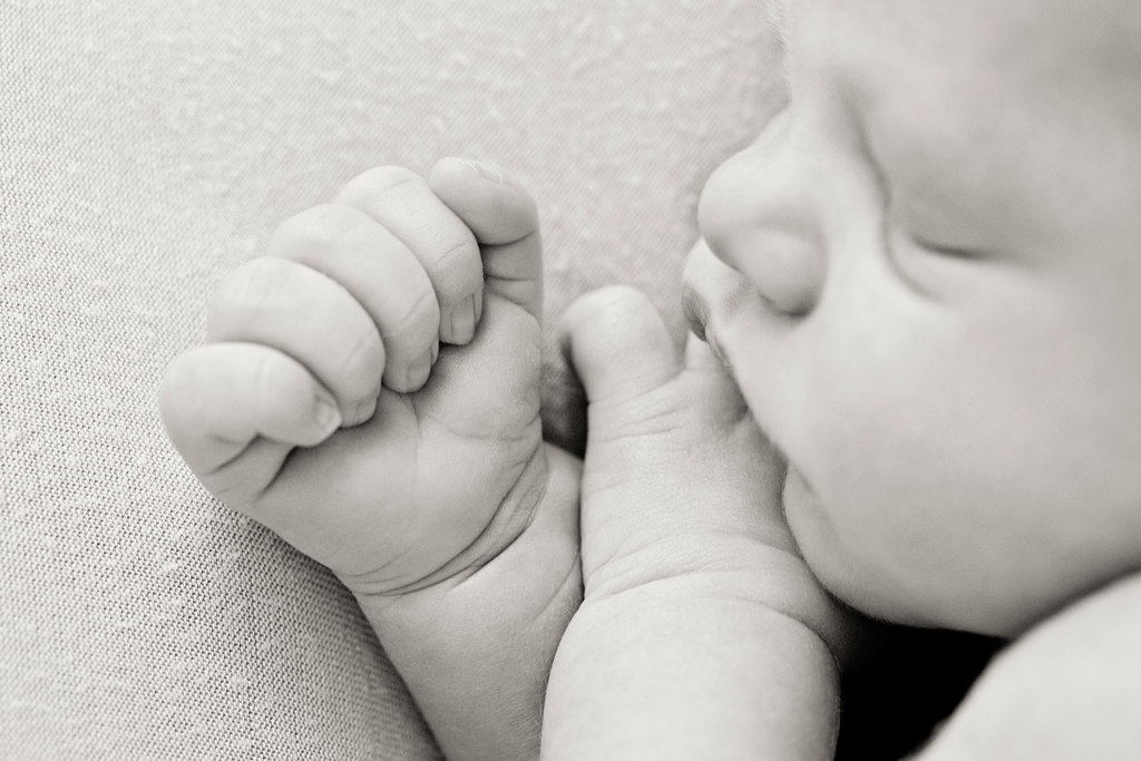 gorgeous sleepy newborn snoozing in studio 