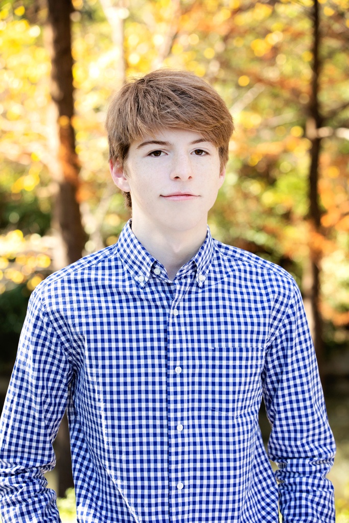 big brother hangs out outside for fall family sessions