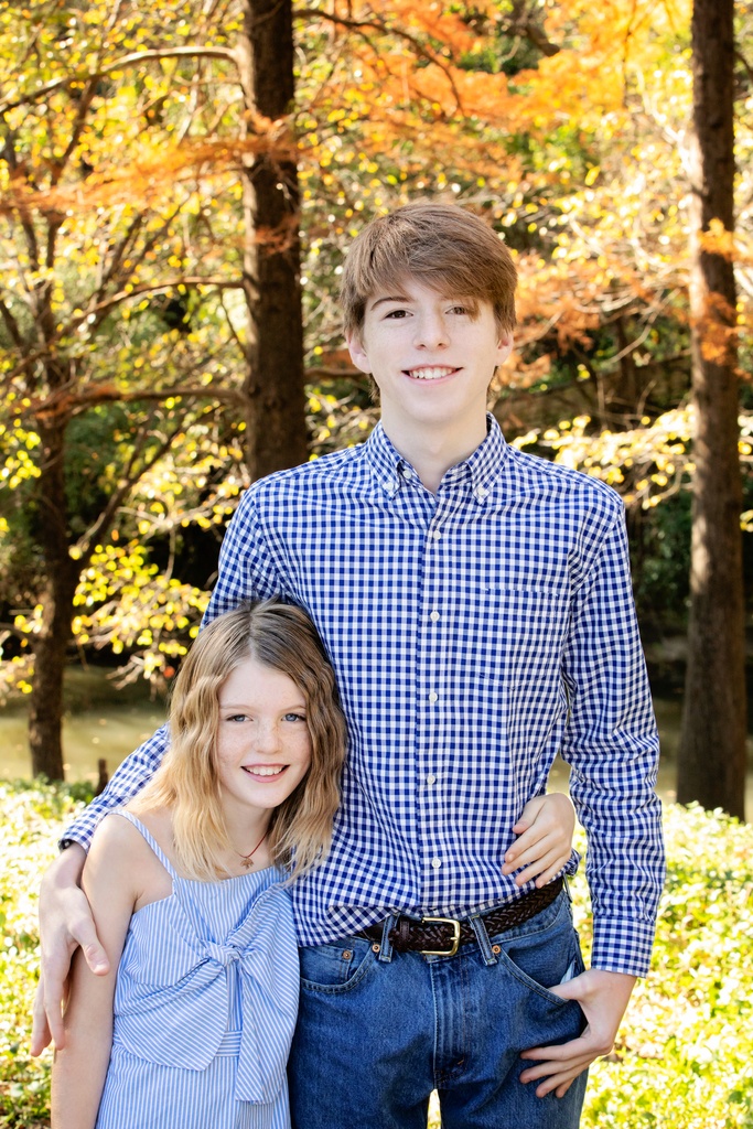 brother and sister pose for family photos