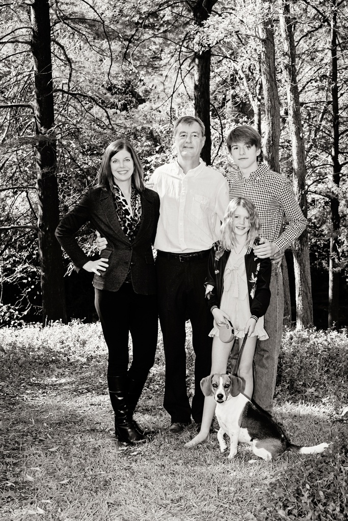 gorgeous family poses with dog outside for photo session
