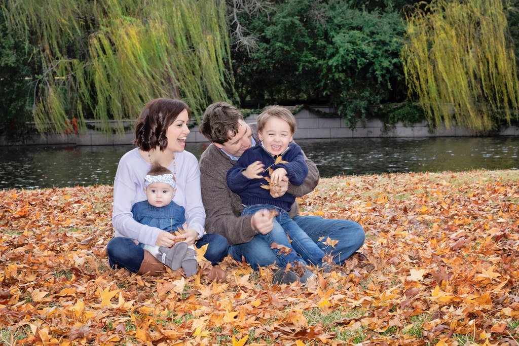 beautiful family of four poses outside for memorable photos