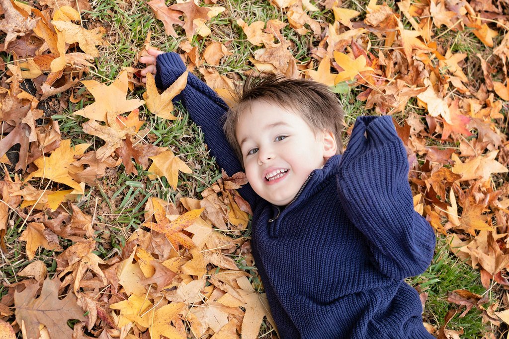 beautiful family of four poses outside for memorable photos