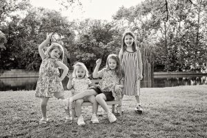 group of personality-filled sisters in outdoor session by lake