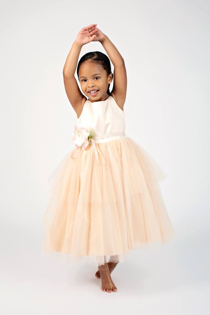 big sis and newborn sister grab adorable shots in private Dallas studio