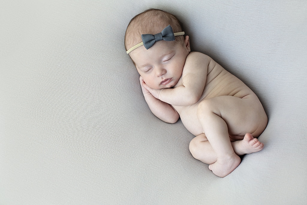 adorable baby girl wide awake in private studio